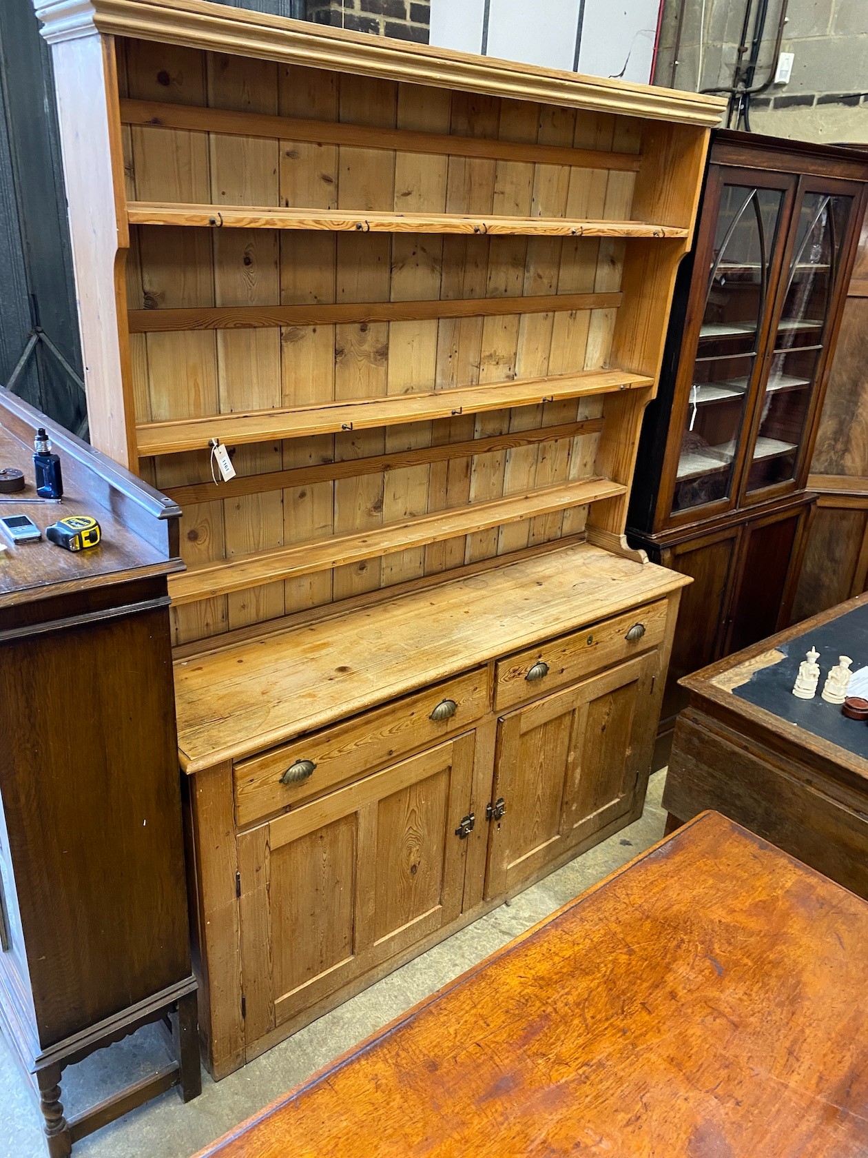 A Victorian pine dresser with boarded rack, length 173cm, depth 44cm, height 230cm